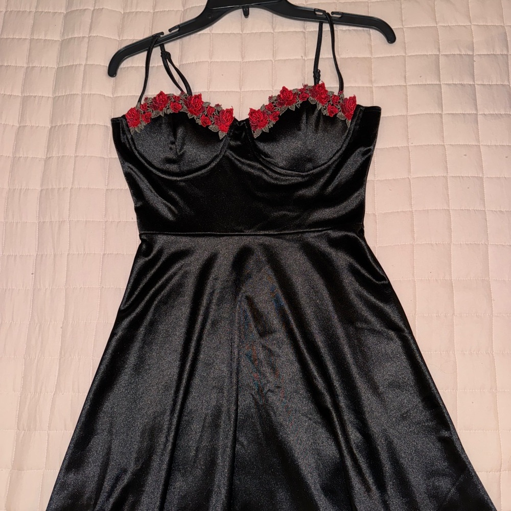 Elegant Black Dress with Red Floral Accents